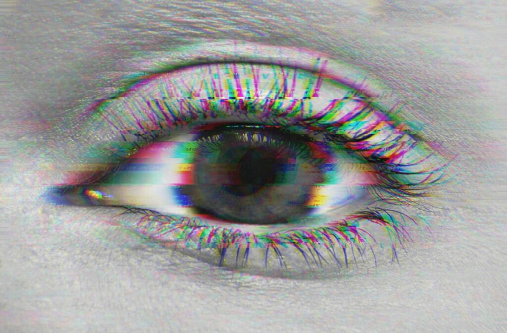 In an image of a person's eye, faint stripes obscure and blur the eye to represent blurred vision from dry eye.